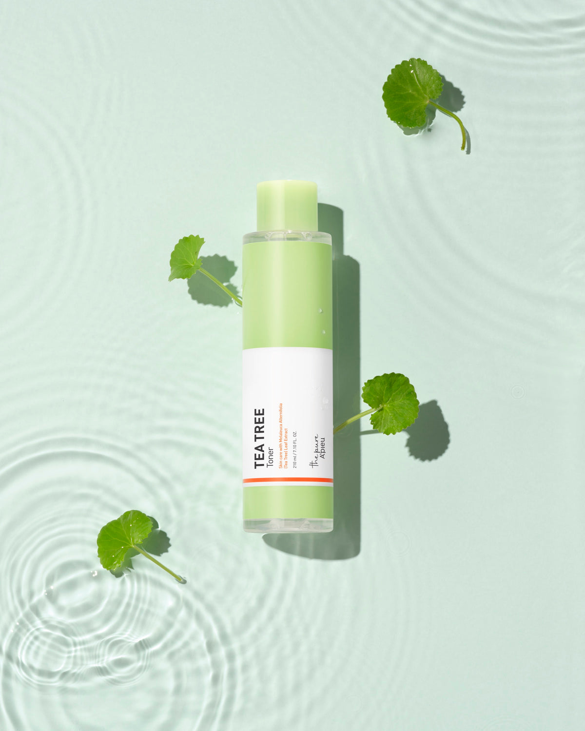 A'PIEU The Pure Tea Tree Toner styled beside water ripples