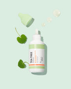 A'PIEU The Pure Tea Tree Essence bottle and cap with essence droplets