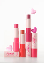 A'PIEU Candy Color Balm trio displayed open with heart-shaped props