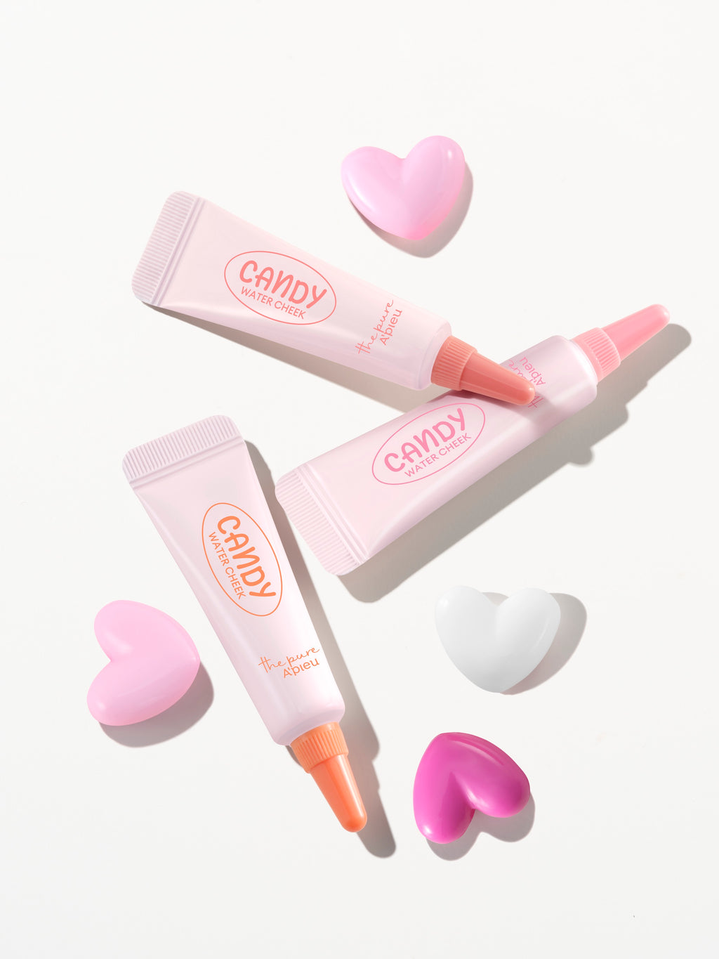 A'PIEU Candy Water Cheek three shades styled with heart-shaped props