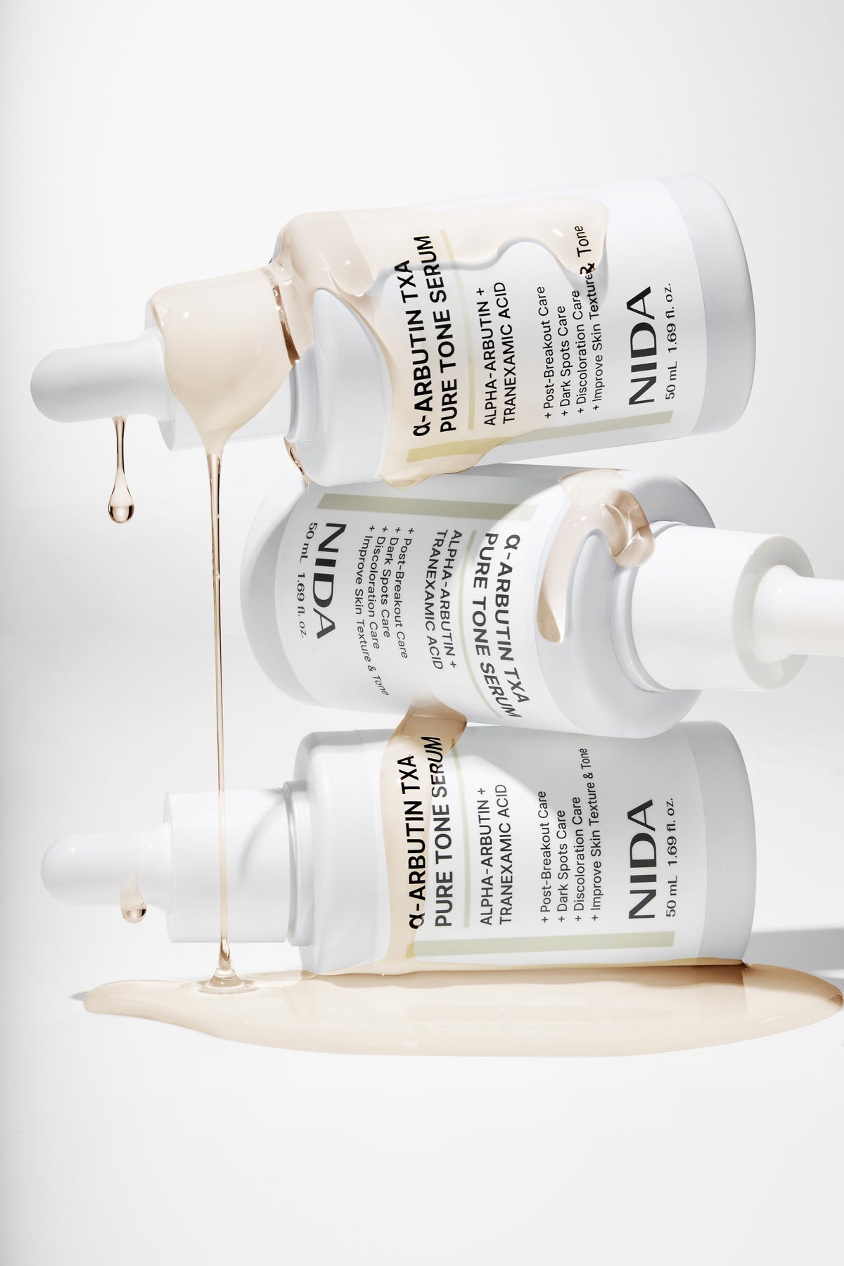 NIDA Alpha-Arbutin TXA Pure Tone Serum 50ml — product photography