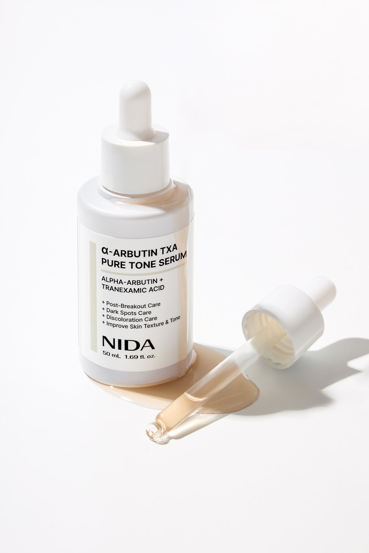 NIDA Alpha-Arbutin TXA Pure Tone Serum 50ml — product detail and texture